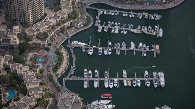 Beautiful moving timelapse in Dubai UAE from princess tower showing traffic at night of the marina port at slow shutter speed