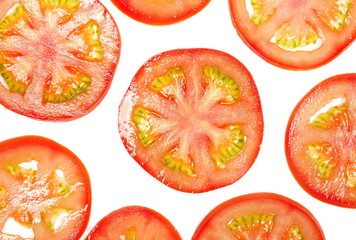 Ripe red tomato slices isolated on white background, top view