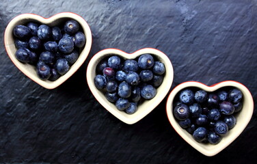 fresh blueberries in heart shaped dishes
