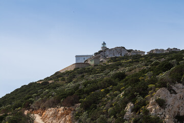 Fototapeta na wymiar Lighthouse on a rock, Sardinia, Italy