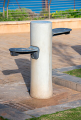 Naklejka premium drinking fountain in a city park