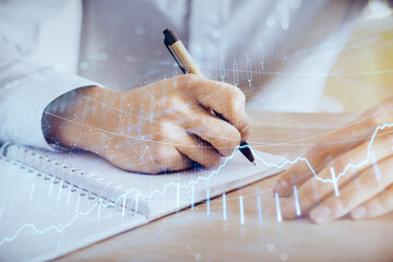 Multi exposure of man planing investment with stock market forex chart.