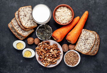 Products containing vitamins B1 (thiamine) on a stone background