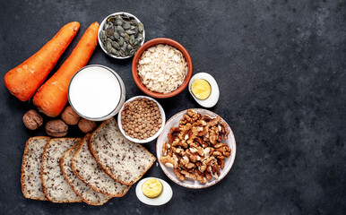 Products containing vitamins B1 (thiamine) against a stone background with copy space for your text