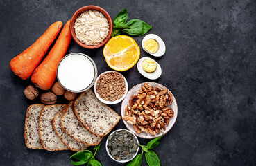 Products containing vitamins B1 (thiamine) against a stone background with copy space for your text