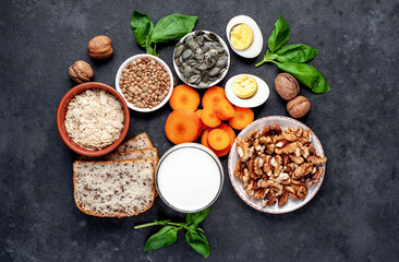 Products containing vitamins B1 (thiamine) on a stone background