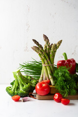 Obraz na płótnie Canvas Asparagus bunch and broccoli still life, food close up