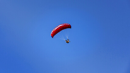 a pair of gliders flying over the mountains 3