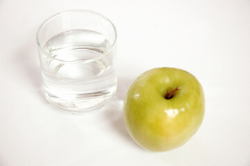 Glass of Water and Green Apple
