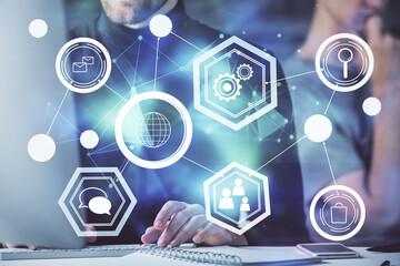 Media network theme hologram with man working on computer on background. Concept of internet communication. Double exposure.