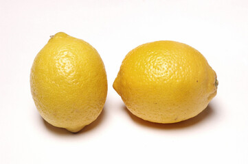 Two Lemons, Close Up on white background .