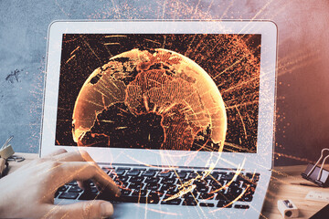 Media network theme hologram with man working on computer on background. Concept of internet...