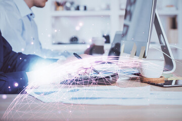 Media network theme hologram with man working on computer on background. Concept of internet...