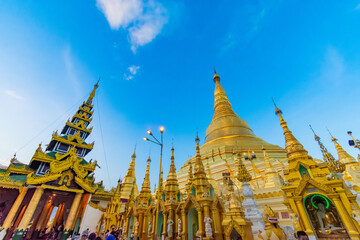 YANGON,MYANMAR-MAY 15.2020: Buddhist Pilgrims in the Shwedagon Pagoda at night. It is the most sacred Buddhist pagoda for the Burmese.