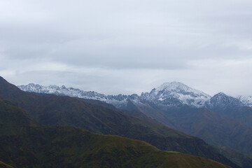lower Himalayan mountain range with snow and clouds
