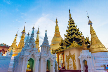 Fototapeta premium Buddhist Pilgrims in the Shwedagon Pagoda at night. It is the most sacred Buddhist pagoda for the Burmese.