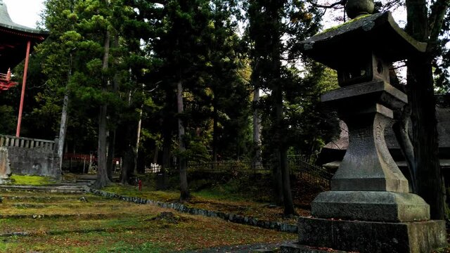 A stone lantern at a japanese shrine