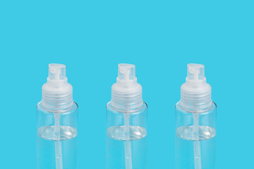 Hand sanitizer bottles on blue background for COVID-19. Hygiene Coronavirus concept.