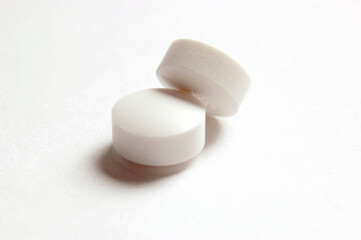 Fototapeta na wymiar Stacked Pills, Close Up on white background .