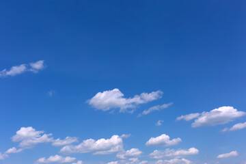 Blue sky background with white clouds.
