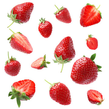 Set With Ripe Strawberries Falling On White Background