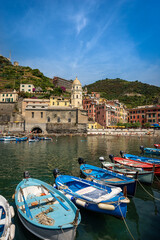 Ancient village of Vernazza with the boats in the harbor. Cinque Terre, National park in Liguria, La Spezia province, Italy, Europe. UNESCO world heritage site