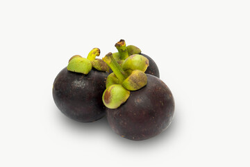 Mangosteen isolated on white background. The famous delicious fruit from Thailand or call The Queen of Fruits