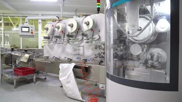 industrial candy wrapper line on factory. automation of production.