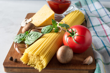 Spaghetti and ingredients for making pasta. Italian food concept