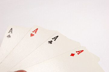 Poker cards with four A on white background .