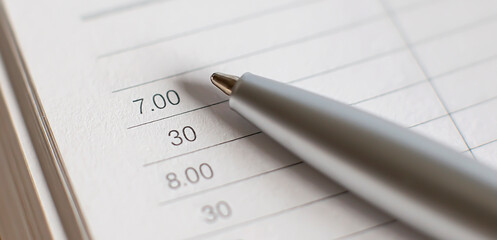 Business Diary. Empty paper sheets with numbers and dates, metal pen.Trendy self-organization concept ,minimalist planners Daily, weekly, monthly planner.