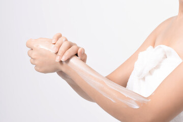 Women use body lotion on her arms.