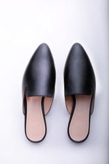ballet shoes on a white background, black women’s flat shoes, classic, leather mules and loafers, leather substitute