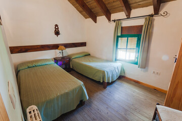 Bedroom inside an old-style rental cottage.
