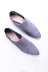 urban gray loafers, modern casual women&rsquo;s flat shoes, classic, suede mules and loafers, leather substitute, stylish on a white background, studio