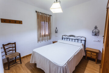 Bedroom inside an old-style rental cottage.