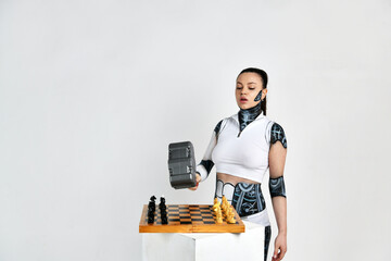 beautiful brunette girl in a robot suit beats with a hammer on a chessboard