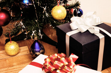 Shot of Christmas ball Ornaments Mockup and Tree with gifts
