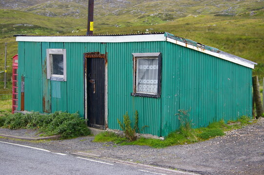 An old, deserted, green corrugated building on Scalpay, Isle of Harris, Western Isles, Scotland