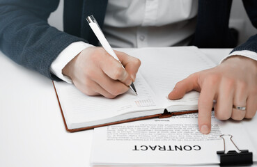 Cropped view of businessman works with financial papers at the table. Finance concept