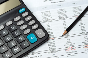 Pencil And Calculator On Financial Report - Business Accounting Concept