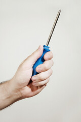 Hand with Screwdriver on white background