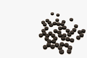 pills on white background, activated carbon on white background