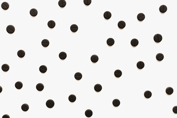 pills on white background, activated carbon on white background