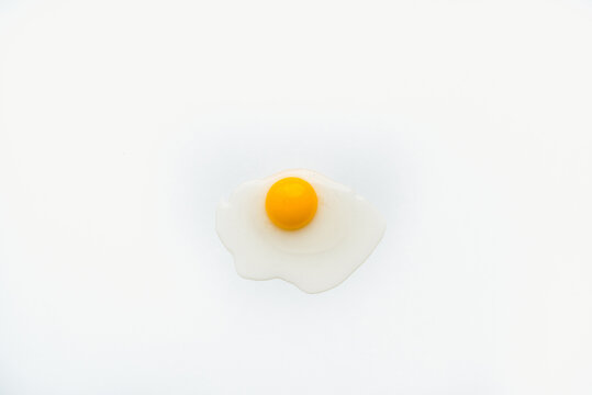 chicken yolk on a white plate, chicken eggs on a white plate, chicken yolk