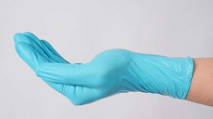 Empty with blue latex glove on white background.