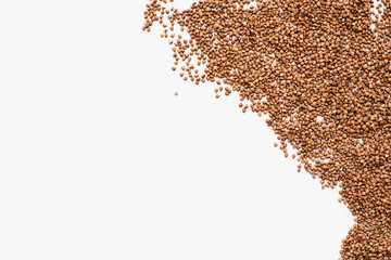 Naklejka premium buckwheat groats on a white background, a bunch of buckwheat