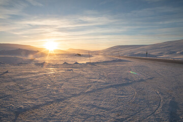 Sunset during a snow storm in the arctic circle. 