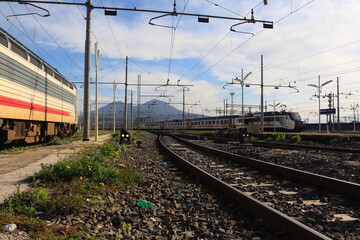 Fototapeta na wymiar train on railway station with Vesuvius on the background