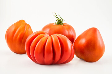 Red tomatoes on isolated on a white background.